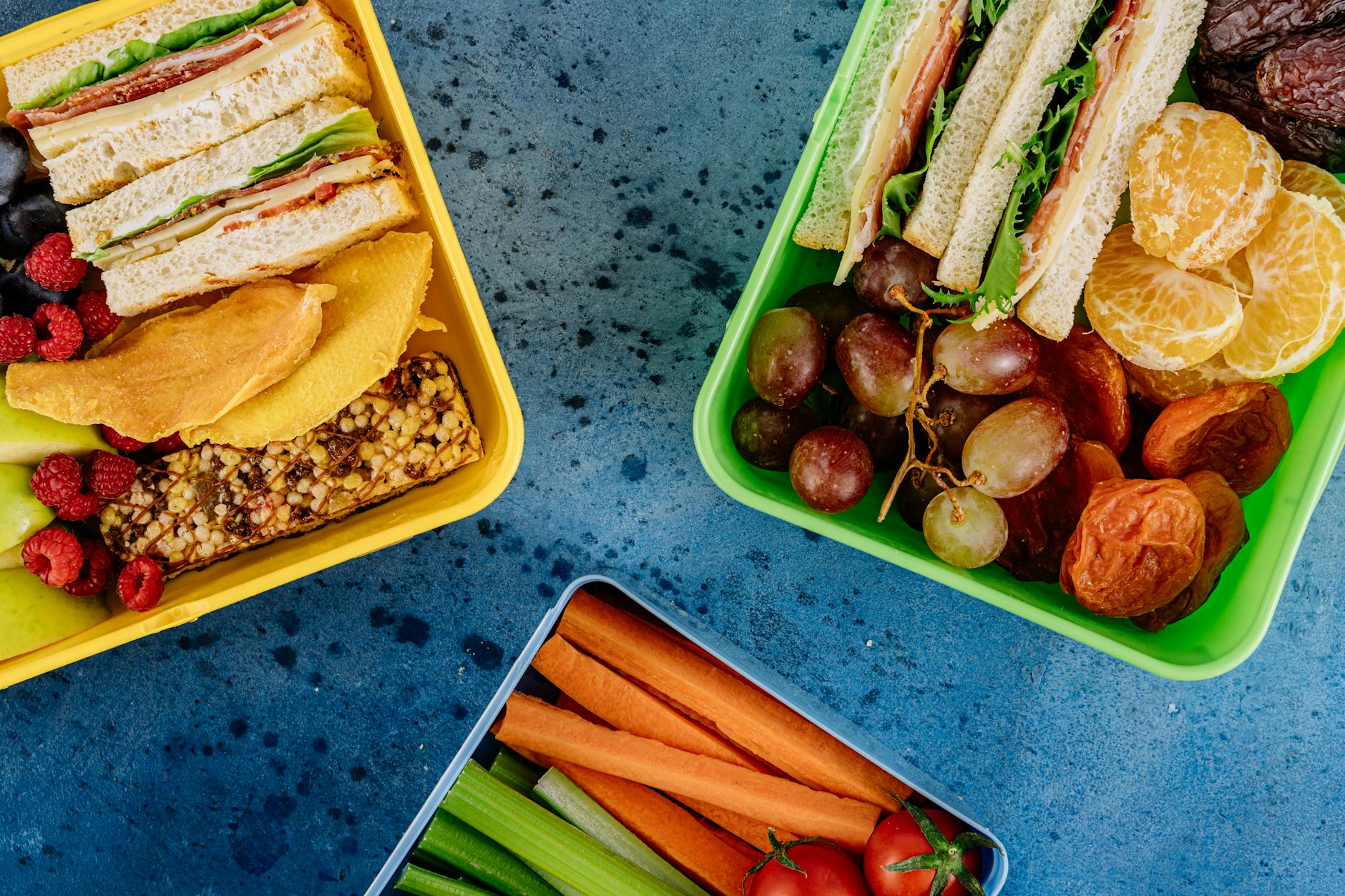 overhead shot of healthy snacks in plastic containers